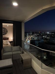 a room with a view of a city at night at Modern Vero Apartments Portova in Gdynia +16 photos