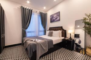 Postel nebo postele na pokoji v ubytování Tân Villa 2 Đà Lạt