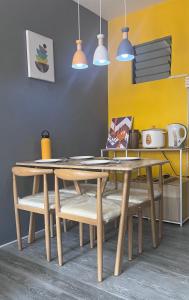 a dining room with a wooden table and chairs at Fully-furnished House Near Puan, Bago & Baliok in Davao City in Davao City