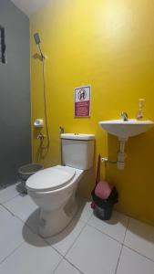 a bathroom with a toilet and a sink at Fully-furnished House Near Puan, Bago & Baliok in Davao City in Davao City