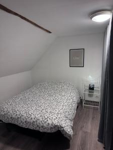 Letto o letti in una camera di Gîte familial dans le vignoble champenois
