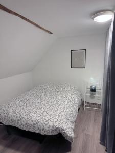 Letto o letti in una camera di Gîte familial dans le vignoble champenois