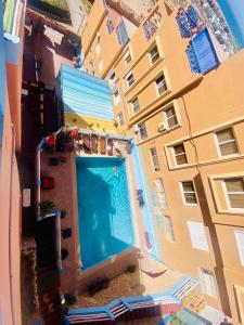 an overhead view of a swimming pool next to a building at Terrasseplage appartement N9 in Tamraght Ouzdar