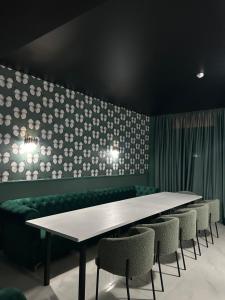 a dining room with a table and chairs at Эль in Aktau