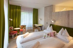 Voodi või voodid majutusasutuse Familienhotel Felsenhof toas