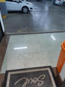 a sign on the floor of a parking lot at Soul Housing & Shop · Studio com varanda. Noroeste. Soul Housing & Shop in Brasilia
