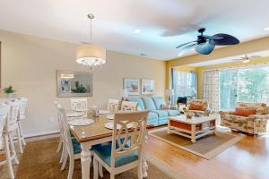 a living room with a table and a couch at Bayville Shores --- 35729 Coleman Ave in Selbyville