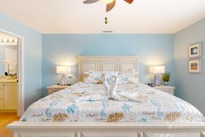 a bedroom with a large bed with blue walls at Bayville Shores --- 35729 Coleman Ave in Selbyville +27 photos