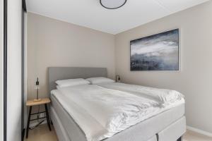 Кровать или кровати в номере Stay North Slottsparken