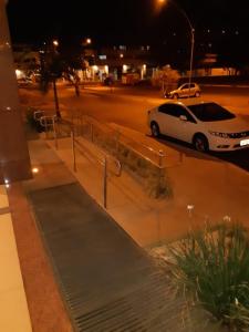 a white car parked in a parking lot at night at Soul Housing & Shop · Studio com varanda. Noroeste. Soul Housing & Shop in Brasilia +66 photos