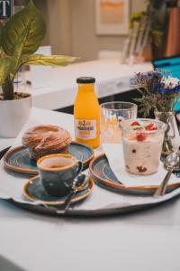 a table with a plate of food and a cup of coffee at Polzeath Beach House in Polzeath