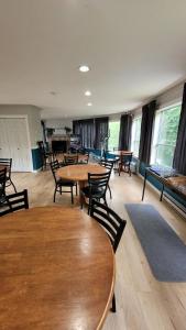 a large room with tables and chairs and windows at Ridgeview Motor Inn in Gold River