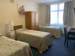Postel nebo postele na pokoji v ubytování St Simeon