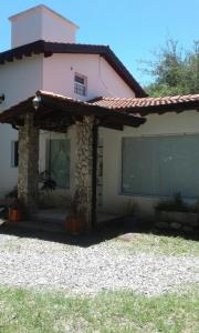 a house with a large window on the side of it at Carpe Diem in La Paz