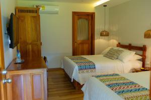 Postelja oz. postelje v sobi nastanitve Hotel Dos Rios