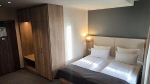 Postel nebo postele na pokoji v ubytování Hotel St.-Michaels-Heim