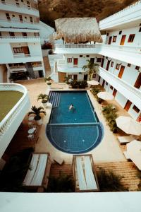 Bazén v ubytování Hotel Abitti Taganga nebo v jeho okolí