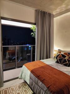 En eller flere senge i et værelse på Studio na Paulista Metrô Paraíso