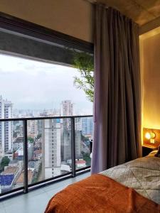 En eller flere senge i et værelse på Studio na Paulista Metrô Paraíso