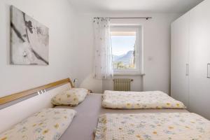 Postel nebo postele na pokoji v ubytování Apartment Rungg