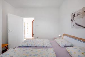 Postel nebo postele na pokoji v ubytování Apartment Rungg