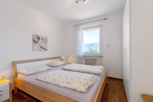Postel nebo postele na pokoji v ubytování Apartment Rungg