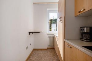 Kuchyň nebo kuchyňský kout v ubytování Apartment Rungg