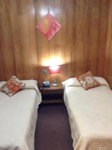 Postel nebo postele na pokoji v ubytování Hotel Le Mirage