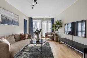 Телевизор и/или развлекательный центр в Stay North Slottsparken