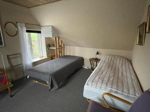 Bøgebjerggård客房内的一张或多张床位