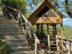 a building with stairs and a stair case at Hostel & Glamping Santa Fortunata in Sorrento