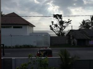 a view of a street with a house and a building at Villa 133 - 2 bed rooms in Dodanduwa