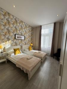 Postel nebo postele na pokoji v ubytování CENTER rooms