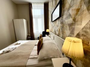 Postel nebo postele na pokoji v ubytování CENTER rooms