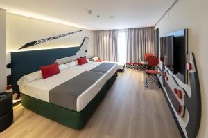 Postel nebo postele na pokoji v ubytování Hotel Magic Sports 4