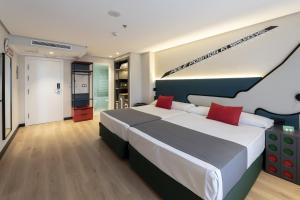 Postel nebo postele na pokoji v ubytování Hotel Magic Sports 4