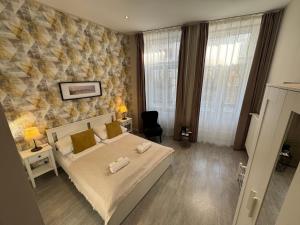 Postel nebo postele na pokoji v ubytování CENTER rooms