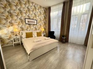Postel nebo postele na pokoji v ubytování CENTER rooms