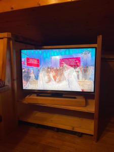 A television and/or entertainment centre at Attico Vista Tofane