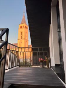 a view of a building with a clock tower at Casa Toma M in Baia Mare