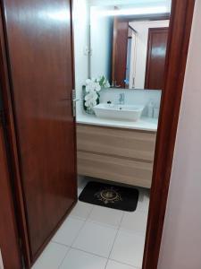 a bathroom with a sink and a mirror at Buddies Charm House in Aveiro +89 photos