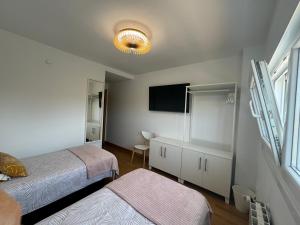Apartamentos Olga Cantabria客房内的一张或多张床位