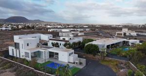 an aerial view of a large white house at TURQUESA 1 e TURQUESA 2 Fuerteventura in La Oliva