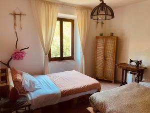 Katil atau katil-katil dalam bilik di Casa della Nonna