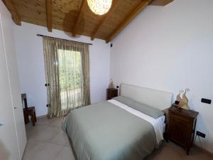 Postel nebo postele na pokoji v ubytování Al Vigneto