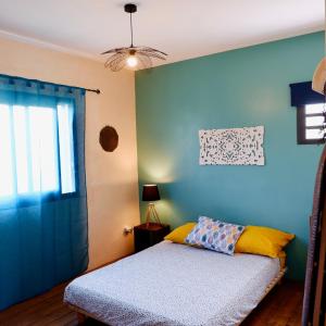 Postel nebo postele na pokoji v ubytování kaz à Nat - Chez L'Habitant