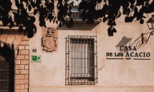 a building with a window and a sign on it at Casa de los Acacio in San Clemente