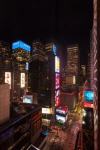 a view of a city at night with buildings at Hotel Edison Times Square in New York