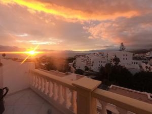 a view of the sunset from the balcony of a house at Monamie-Windsor Park in Adeje