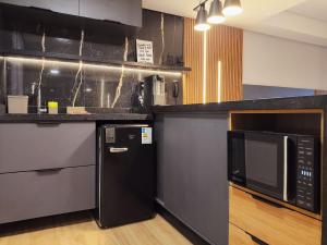 Køkken eller tekøkken på Flat Luxo Frente Mar com Vista Espetacular